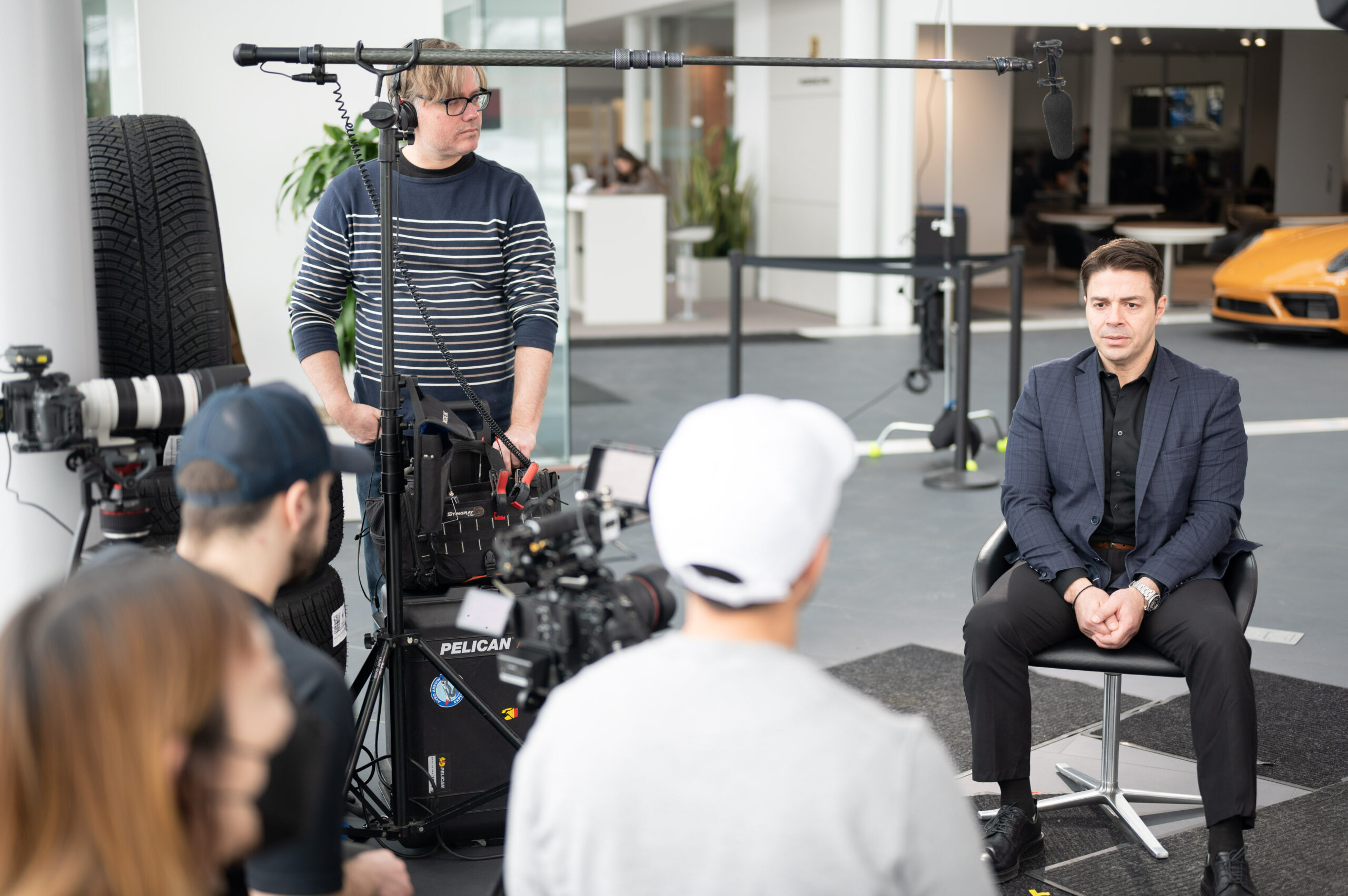 Behind-the-scenes image showing the Lapse Productions crew expertly setting up for an on-location interview shoot, capturing the synergy and professionalism that goes into producing high-quality video content.