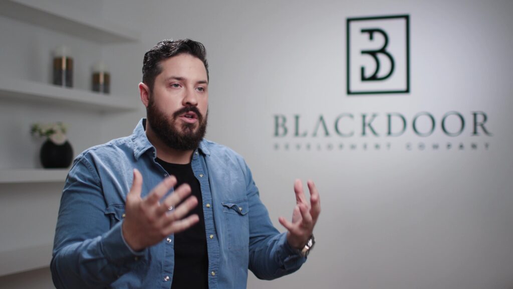 Example of engagement pose with talent actively using hands to emphasize points in an explainer video.