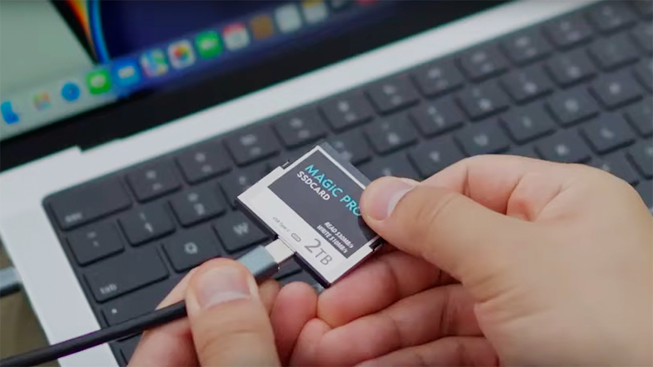 Image showing a fast card being backed up on a laptop during post-production.