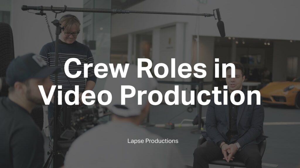 A behind-the-scenes picture of a corporate interview shoot with the words 'Crew Roles in Video Production' and 'Lapse Productions' superimposed on it.