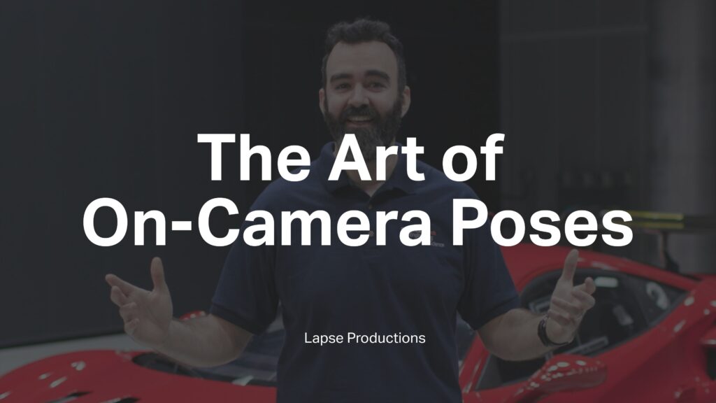 A middle-aged man with his arms open with a Ferrari Evo behind him in a wind tunnel with the words 'The Art of On-Camera Poses' and 'Lapse Productions' superimposed on it.